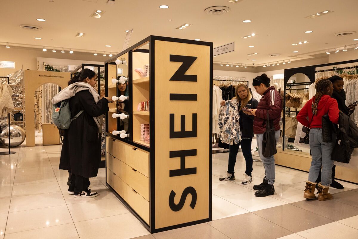 Color photo of people shopping at SHEIN store.